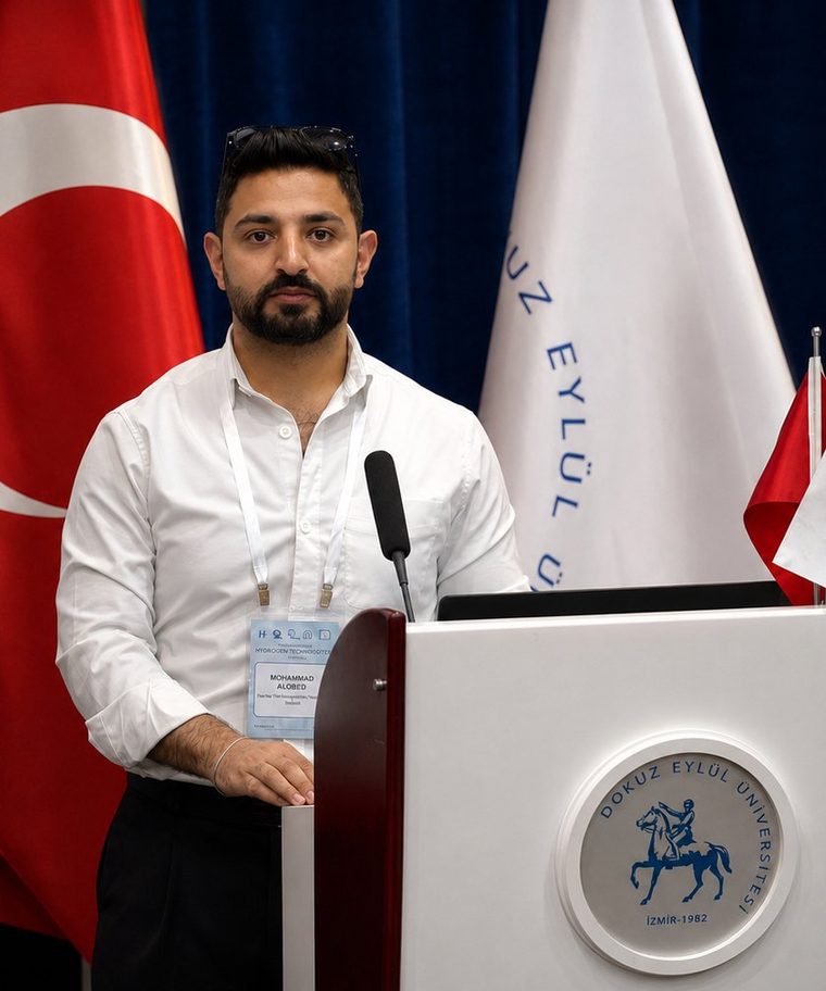 Dr. Mohammad Alobeid speaking at a lectern at Dokuz Eyl&uuml;l University